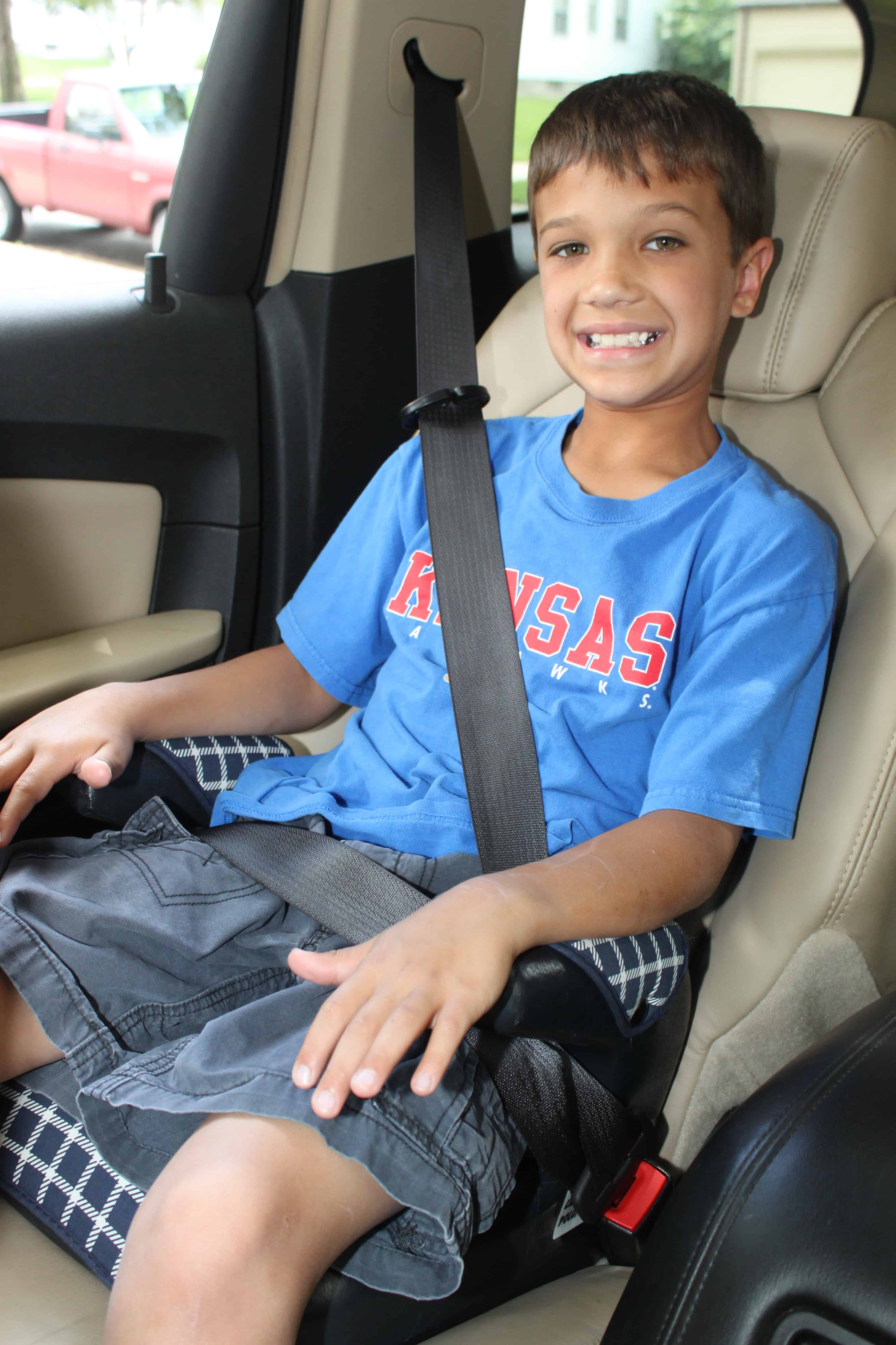 When can my child stop using a booster seat in the car?